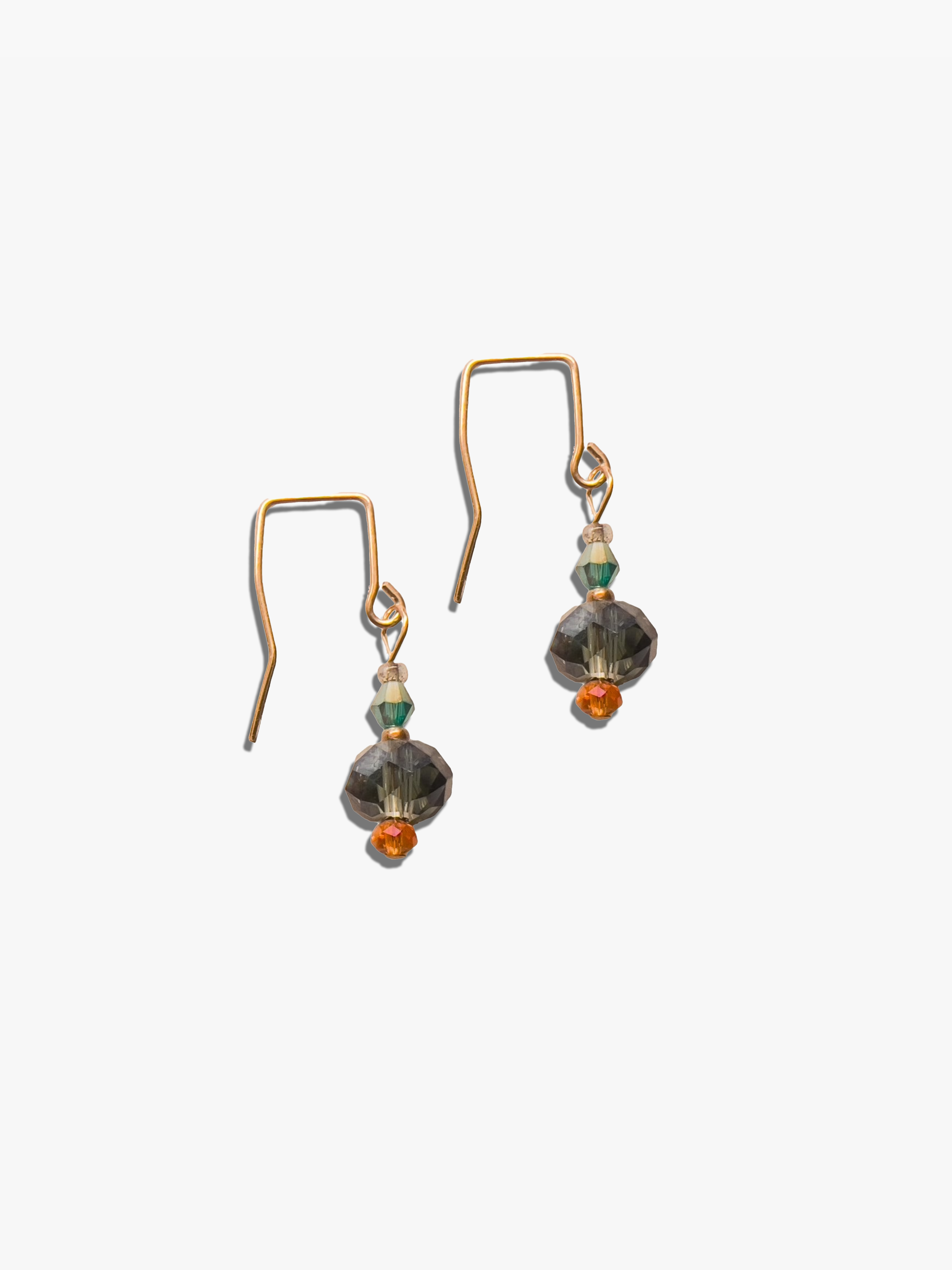 Pair of earrings with beads on a white background